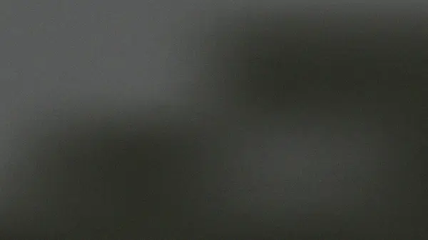 Koyu gri bir gradyanı olan ince desenli bir arkaplan resmi. Doku iyi ve neredeyse algılanamaz. Pürüzsüz ama hafif bir görsel etki yaratıyor..