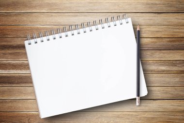 Not defteri veya defter ile eğitim, iş fotoğraf için kahverengi ahşap masa background.using duvar kağıdı üzerinde kalem. Ürün Rehberi kağıt ve genel kavram, nesne ya da kopya alanı için dikkat.