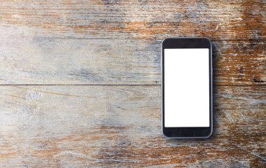 Eski ahşap arka plan kopya alanı ile akıllı telefon. Üstten Görünüm