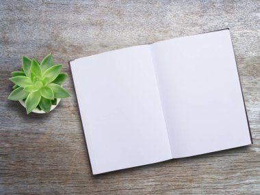 Top view blank open book mock up on wood table background, catalog, magazines, brochure, note template with paper texture on office desk.