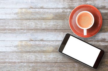 Düz yatıyordu ahşap Ofis Büro Ofis donatım ve akıllı telefon ve ahşap arka plan üzerinde kahve. Üstten Görünüm kopya alanı (seçici odak) ile. Ofis Resepsiyon Masa ve iş kavramı.