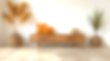 Ahşap bir dolap, dekoratif yastıklar ve şık saksı bitkilerinin yer aldığı modern oturma odası. Tasarım, sıcak renkler ve doğal elementlerle samimi ve davetkar bir atmosfer yaratıyor..