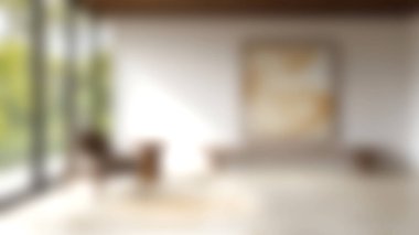 Zarif bir sandalye ve minimalist bir sanat eserinin yer aldığı sakin, modern bir iç mekan, doğal ışıkla yıkanmış, sakin ve davetkar bir atmosfer yaratıyor..