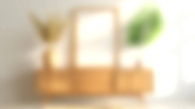 Dekoratif vazolar ve yeşilliklerle dolu ahşap bir dolabın olduğu parlak ve davetkâr bir oturma odası. Kompozisyon minimalizmi ve doğal ışığı vurguluyor..