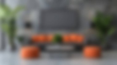 Turuncu aksanla tamamlanmış çarpıcı gri duvarlar sergilenen modern bir oturma odası keşfedin. Mobilyalar ve yemyeşil bitkiler rahat bir ortam yaratır..