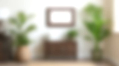 Ahşap bir konsol masası, dekoratif bitkiler ve modern tasarım elementlerinin yer aldığı parlak ve davetkâr bir yaşam alanı. Ev dekorasyonu için mükemmel..