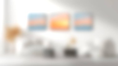 Günbatımı siluetini tasvir eden soyut sanat eserlerinin yer aldığı sakin, modern bir oturma odası. Samimi mobilyalar zarafet katıyor, mükemmel bir rahatlatıcı atmosfer yaratıyor..