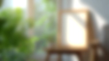 Boş çerçeveli ahşap bir masa ve doğal ışıkta güneşlenen küçük bir bitkinin yer aldığı sakin bir iç mekan sahnesi. Yumuşak yeşillik ve ılık tonlar ilham için mükemmel barışçıl bir ortam yaratır..