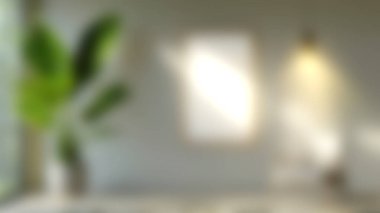 Yeşil bitki ve yumuşak doğal ışığın yer aldığı sakin bir iç mekan sahnesi. Bulanık arka plan, rahatlama ve yaratıcılık için mükemmel huzurlu bir atmosfer yaratıyor..