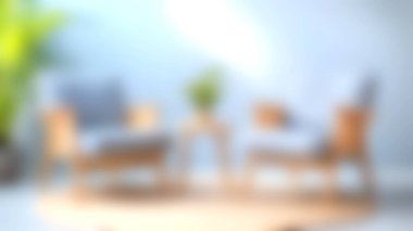 Şık sandalyelerin ve yuvarlak kahve masasının bulunduğu rahat, modern bir oturma odası, rahatlama ve yaratıcılık için mükemmel, parlak ve davetkar bir atmosfer yaratıyor..