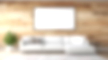 Minimalist dekor, beyaz bir kanepe ve sanata hazır boş bir çerçeve içeren sakin bir oturma odası keşfedin. Konforu ve sadeliği vurgular.