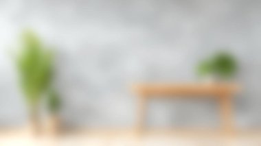 Bu resim, yumuşak, bulanık gri bir duvara karşı, ahşap bir masa ve yemyeşil bitkilerle modern bir minimalist iç tasarımı içerir. İç tasarım temaları için ideal.