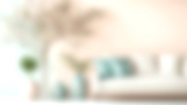 Dekoratif yastıklar ve taze bir bitkinin yer aldığı, ev dekorasyonu için uygun modern ve davetkar bir atmosfer yaratan rahat bir oturma odası görüntüsü..