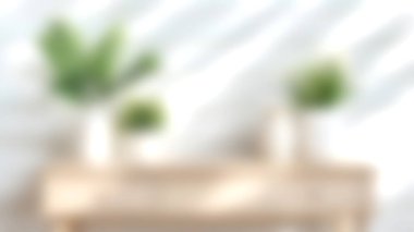 Yeşillik ve doğal ahşap elementlerin yer aldığı minimalist ev dekorunun yumuşak odaklı görüntüsü. Modern iç mekan estetiğini ve rahat atmosferleri sergilemek için mükemmel..