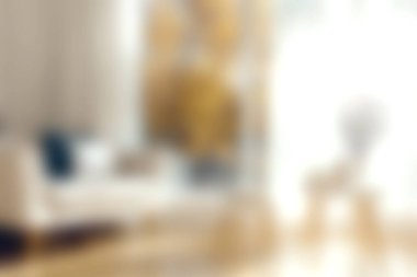 Rahat bir atmosfer için minimalist dekor, rahat mobilyalar ve bol miktarda doğal ışık içeren sıcak ve davetkar bir oturma odası..