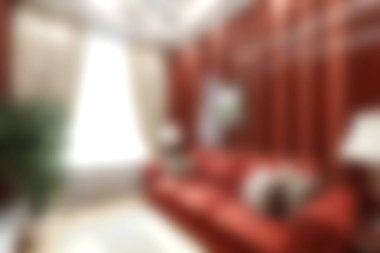 Kırmızı bir kanepe, zarif perdeler ve bol doğal ışık içeren şık bir oturma odası sıcak ve davetkar bir ev atmosferi yaratıyor. Çağdaş iç tasarım ilhamları için ideal..