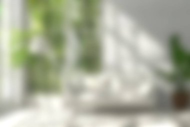 Yumuşak doğal ışıkla yıkanmış yemyeşil bitkilerin bulunduğu sakin ve davetkar bir iç mekan. Parlak atmosfer rahatlamak için rahatlatıcı ve rahat bir alan yaratır..