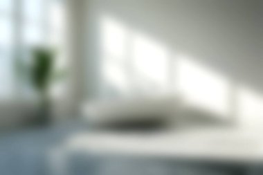 Bu resim, yumuşak doğal ışık ve yeşil bitkinin yer aldığı parlak ve minimalist bir iç mekan sergiliyor. Tasarım huzur ve rahatlığı teşvik eder..