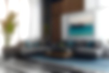 Zarif mobilyaların, rahat koltukların ve doğal ışık ve sanatsal öğelerle dolu davetkar bir atmosferin bulunduğu zarif ve modern bir oturma odası keşfedin..