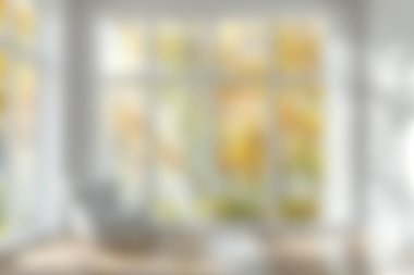 Parlak, rahat bir oturma odası. Geniş pencereleri var. Dışarıdaki yaprakların titreşimini sergiliyor..