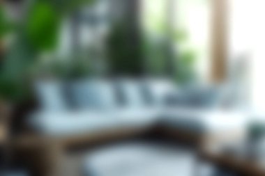 Etrafı yemyeşil bitkilerle çevrili yumuşak bir kanepenin olduğu rahat bir oturma odası. Doğal ışık boşluğu suyla doldurur, rahatlatıcı ve davetkar bir atmosfer yaratır..