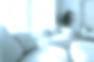 Bu görüntü, yumuşak dokuları ve davetkar atmosferi olan, rahatlama ve rahatlama için mükemmel, parlak ve havadar bir modern oturma odası yakalıyor..