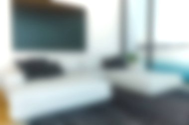 Bu resim, şık mobilyaların ve bol doğal ışığın yer aldığı modern bir oturma odasını gösteriyor. Tasarım rahat ve davetkar bir atmosfer yaratıyor. Rahatlamak ya da eğlenmek için mükemmel..