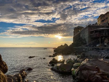 Sunset in Genoa boccadasse. Ligurian riviera. Italy. Boccadasse is a small fishing village in the city of genoa clipart