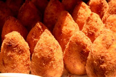 Fried balls rice called arancini, typical sicilian street food
