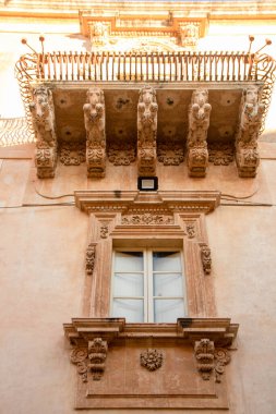 decorated balcony of Nicolaci palace in Via Nicolaci, Noto, Sicily, Italy,