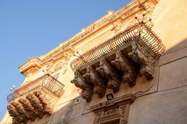 decorated balcony of Nicolaci palace in Via Nicolaci, Noto, Sicily, Italy,
