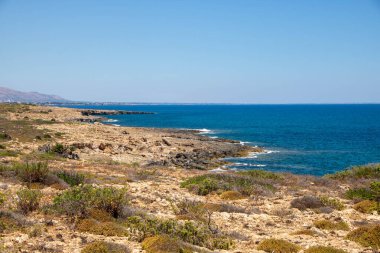 The path between sea and lagoon in the Vendicari Nature Reserve wildlife oasis, located between Noto and Marzamemi, Sicily, Italy