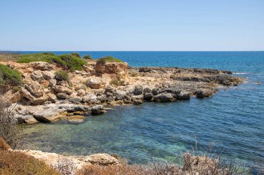 The path between sea and lagoon in the Vendicari Nature Reserve wildlife oasis, located between Noto and Marzamemi, Sicily, Italy