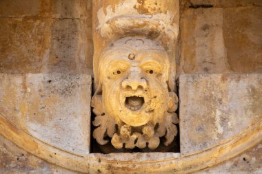 Caruso Palace characterized by what is considered one of the longest baroque balconies in the world. The wrought iron balcony is supported by twenty-seven carved corbels depicting funny masks with different expressions
