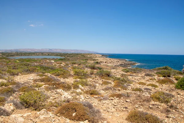 The path between sea and lagoon in the Vendicari Nature Reserve wildlife oasis, located between Noto and Marzamemi, Sicily, Italy