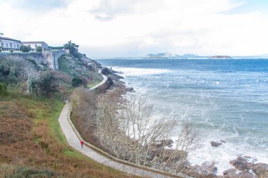 At Baiona - Spain -  on november 2023 - old fortress of monte boi or monte real, overlooking the city and sea clipart