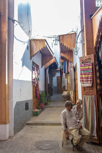 stock image At Rabat Morocco, On august 2024,  two men sitting in a street of the Medina