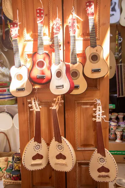 stock image Traditional  wooden ouds and guitars in various colors in  a shop the Medina of Rabat, Morocco