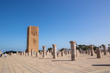 At Rabat Morocco, On 04, august, 2024,  Hassan tower , the minaret of an incomplete mosque commissioned by Abu Yusuf Yaqub al-Mansur, the third caliph of the Almohad Caliphate, in  the 12th century clipart