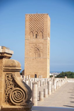 At Rabat Morocco, On 04, august, 2024,  Hassan tower , the minaret of an incomplete mosque commissioned by Abu Yusuf Yaqub al-Mansur, the third caliph of the Almohad Caliphate, in  the 12th century clipart