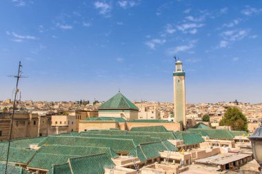 aerial view of the Medina with university and al karaouinemosque green roof and minaret at Fes, Morocco clipart