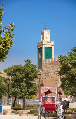 Green minaret of the Grand Mosque in the medina of Meknes, Morocco clipart