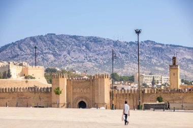 At Fes, Morocco  on  08/07/24,  in  Place bou jeloud and the fortified walls of Fes clipart