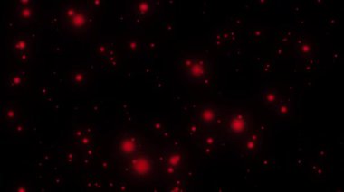 Pırıl pırıl kırmızı parçacıkların kusursuz döngü animasyonu. Siyah arkaplan 4k