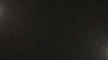 Lüks premium Soyut Yıldız yağmur tozu parlayan parçacıklar yeni bir zemin oluşturuyor. Bokeh 'le parıldayan parıltı. Yeni yıl ve Noel 2024, 2025 Animasyon. Gürültü.