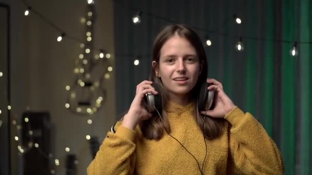 Girl Big Headphones Yellow Sweater Dancing Room — Stock Video