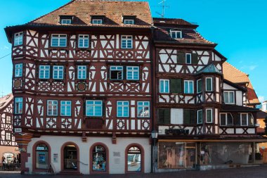 Editorial image of a historic half-timbered building with storefronts and decorative woodwork in Mosbach, Germany. Photographed on 3 Sept. 2025, the structure reflects medieval craftsmanship and cultural heritage.