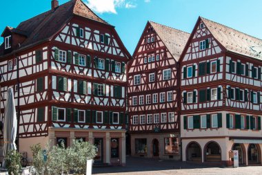 Editorial image of historic half-timbered buildings with red-tiled roofs and arched entrances in Mosbach, Germany. Photographed on 3 Sept. 2025, the scene reflects classic European architecture and cultural heritage.