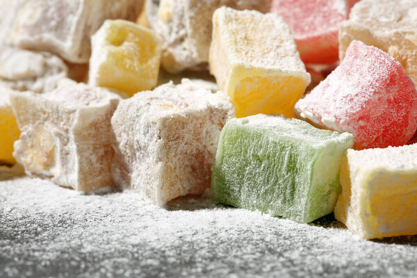 Extreme close up of a heap of many, multi colored turkish delight candies (lokum). Selective focus, shallow depth of field