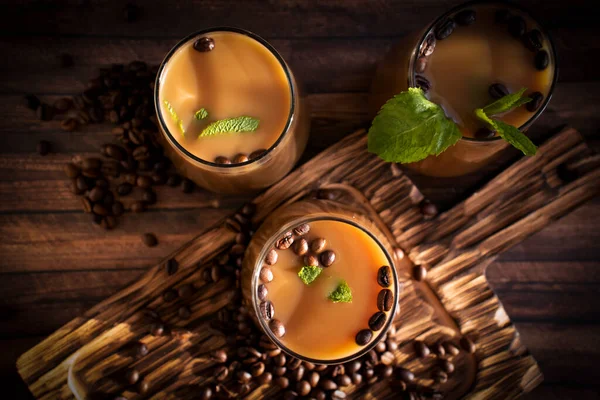 stock image Coffee with milk, mint on a dark background